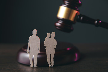 Family figure and gavel on table. Family law concept
