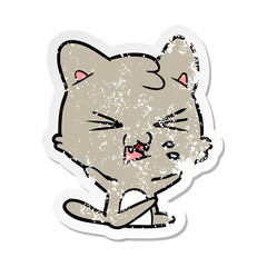 distressed sticker of a cartoon hissing cat