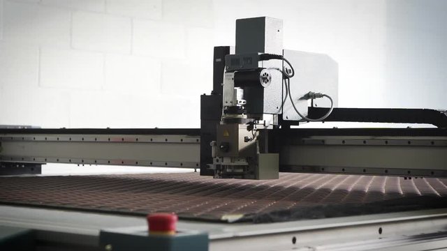 Laser cutting machine in a manufacturing facility.