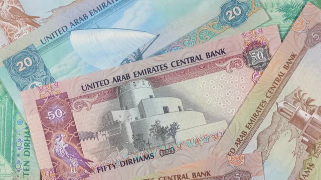 UAE dirham notes slow rotating. Emirates money currency. 4K stock video footage
