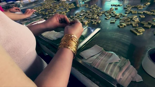 Woman packing Coconut candies in Vietnam.