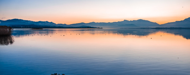 Gorgeous sunrise on the shores of the Upper Zurich Lake (Obersee) between the village of Hurden...