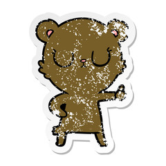 distressed sticker of a peaceful cartoon bear cub
