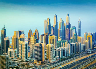 Fototapeta na wymiar Amazing rooftop view on Dubai Marina skyscrapers and Sheikh Zayed road, Dubai, United Arab Emirates