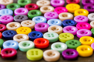 colored buttons close-up. background with sewing accessories.