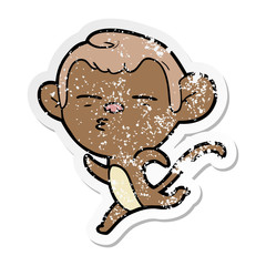 distressed sticker of a cartoon suspicious monkey