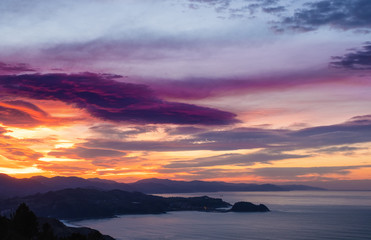 Sunset on the coast of Gipuzkoa with Getaria in the background, Basque Country
