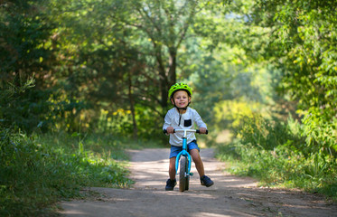 Young boy on balance bike