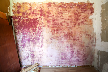 A wall with plaster pattern rough background. Textured backdrop. House repair.