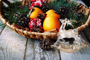 Fototapeta na wymiar christmas decorations cinnamon candles fruit