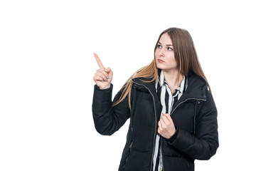 woman in coat points finger