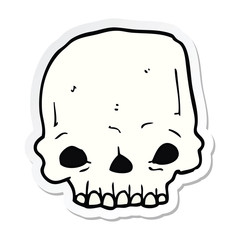 sticker of a cartoon spooky skull