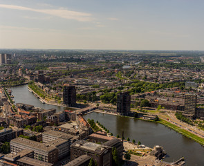 Fototapeta premium Netherlands, Rotterdam, a view of a city next to a body of water
