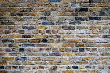 old yellow brick wall background