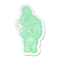 cartoon distressed sticker of a anxious man wearing santa hat