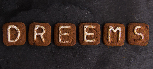 The word DREEMS laid out with cookies letters