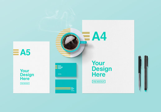 Stationery and Cup of Coffee on Turquoise Surface Mockup