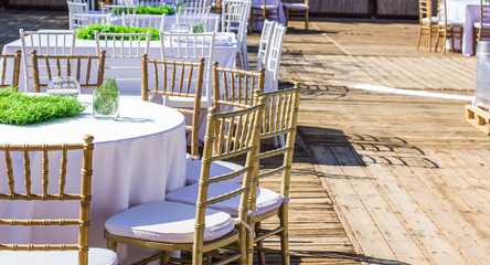 wedding bright pastel and white terrace exterior outdoor environment from dinner banquet event design concept photography  with furniture and dishes