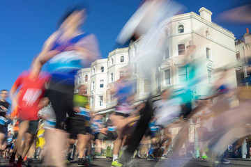 Marathon runners in winter sun