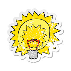 retro distressed sticker of a cartoon light bulb