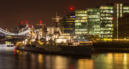 The HMS Belfast at night along the river Thames