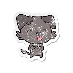 distressed sticker of a cartoon dog sticking out tongue