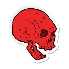 sticker of a cartoon spooky skull