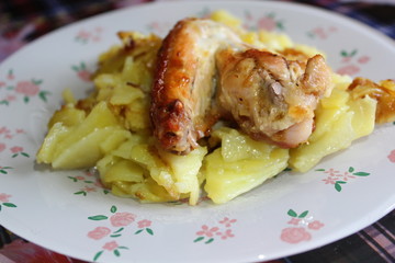 fried potatoes with chicken wings grill