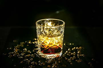 black Russian cocktail. The bartender prepares it in a glass of ice.