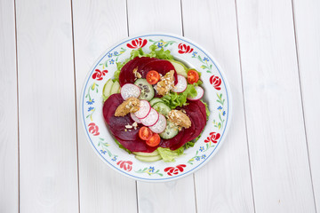 beetroot carpaccio on the wooden background