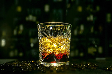 black Russian cocktail. The bartender prepares it in a glass of ice.