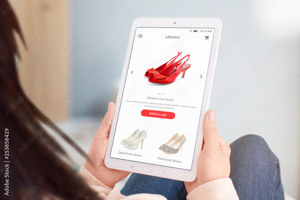Poster close-up tablet with eccommerce web site in woman hands. shoes store concept. flat design interface.