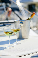 Pair of wineglasses against the yacht