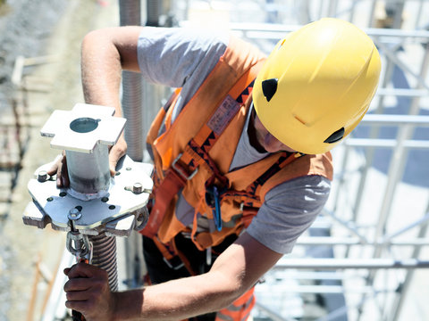 Construction worker fitting pillar