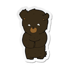 sticker of a cute cartoon black bear