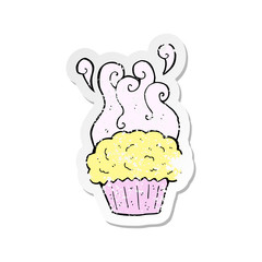 retro distressed sticker of a cartoon cupcake