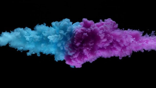 Super slowmotion shot of colorful inks in water. Shot with high speed camera at 4K.