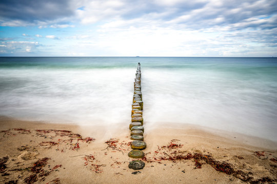 Germany, Heiligendamm, Baltic Sea, breakwater, view from beach to horizon, long exposure