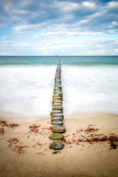 Germany, Heiligendamm, Baltic Sea, breakwater, view from beach to horizon, long exposure
