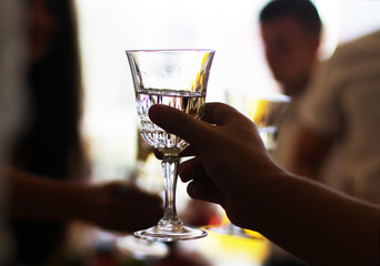 raised champagne glass at banquet on meeting