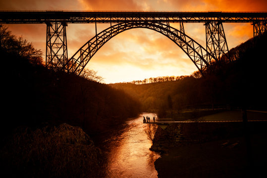 Germany, Muengsten Bridge between Solingen and Remscheid with Wupper in the foreground at twilight