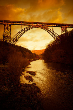 Germany, Muengsten Bridge between Solingen and Remscheid with Wupper in the foreground at twilight