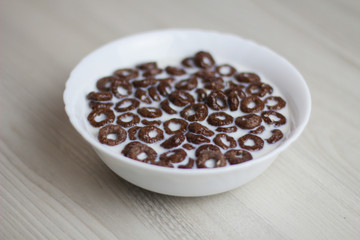 ready breakfast with chocolate rings and milk