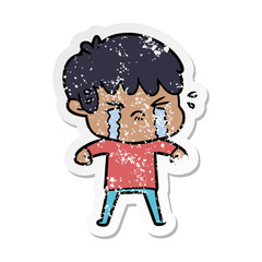 distressed sticker of a cartoon boy crying
