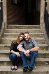 Attractive young couple sitting on steps