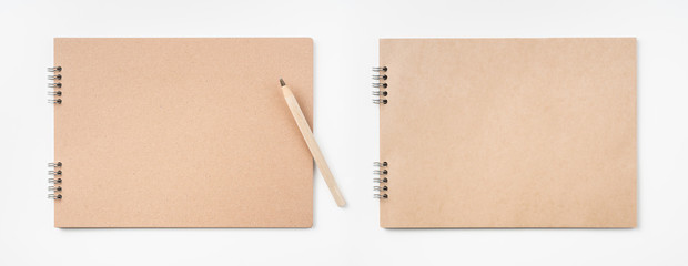 kraft notebook and pen on white background