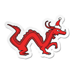 sticker cartoon of a dragon wearing santa hat