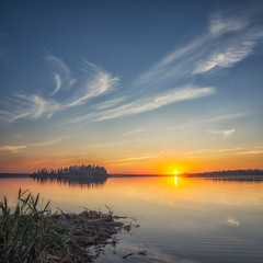 Naklejka na ściany i meble A beautiful sunset of a lake in Alberta from a couple of summers ago.