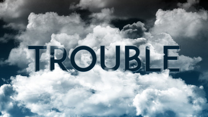 Word TROUBLE in colorful clouds, communication concept 