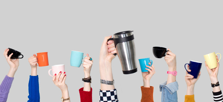 Many Different Hands Holding Coffee Cups